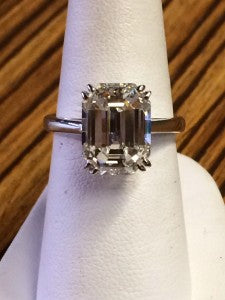 Classic Solitaire For This 4.88 Carat Emerald-Cut Diamond