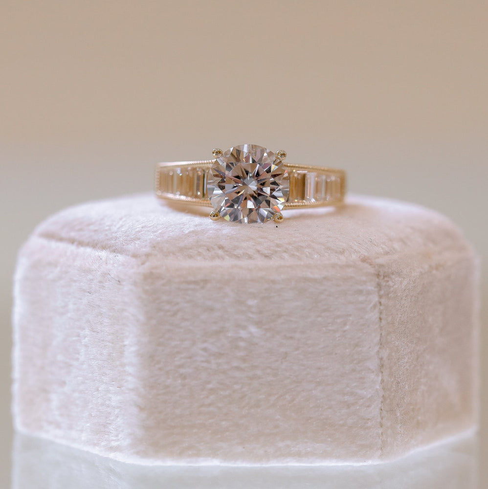 14ky .69ctw Round & Graduated Baguette Diamond Ring