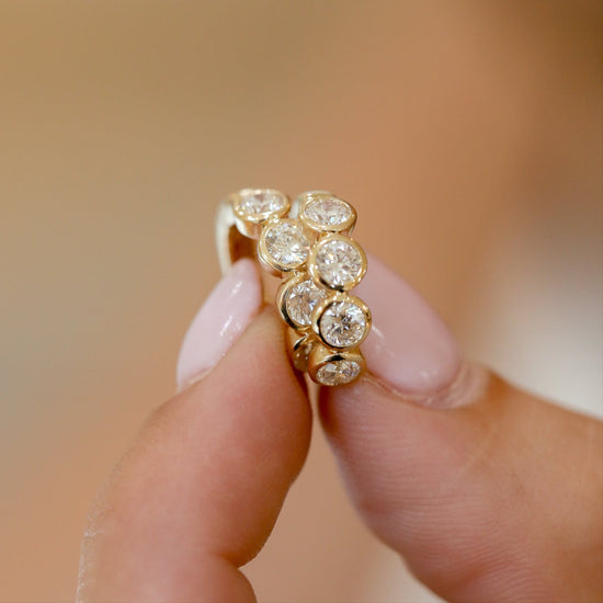 14ky 1.50ctw 4 Round Bezel Huggies