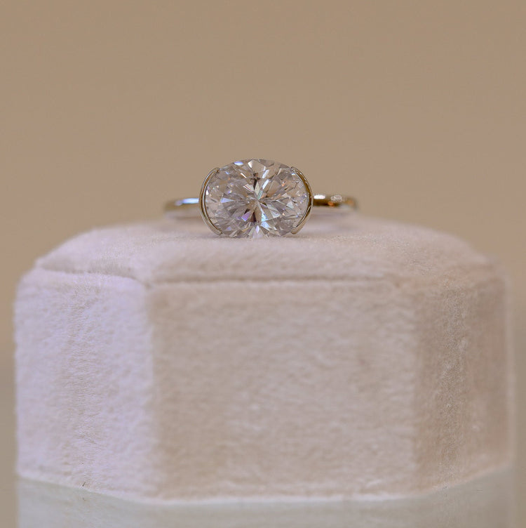 14kw East-West Oval Half Bezel Diamond Solitaire Ring