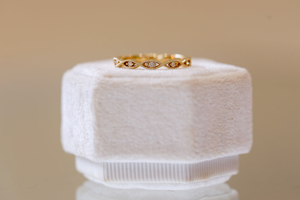 14ky .05ctw Twisted Marquise Shaped Milgrain Band