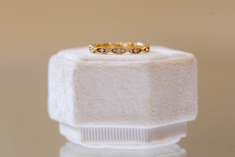 14ky .05ctw Twisted Marquise Shaped Milgrain Band