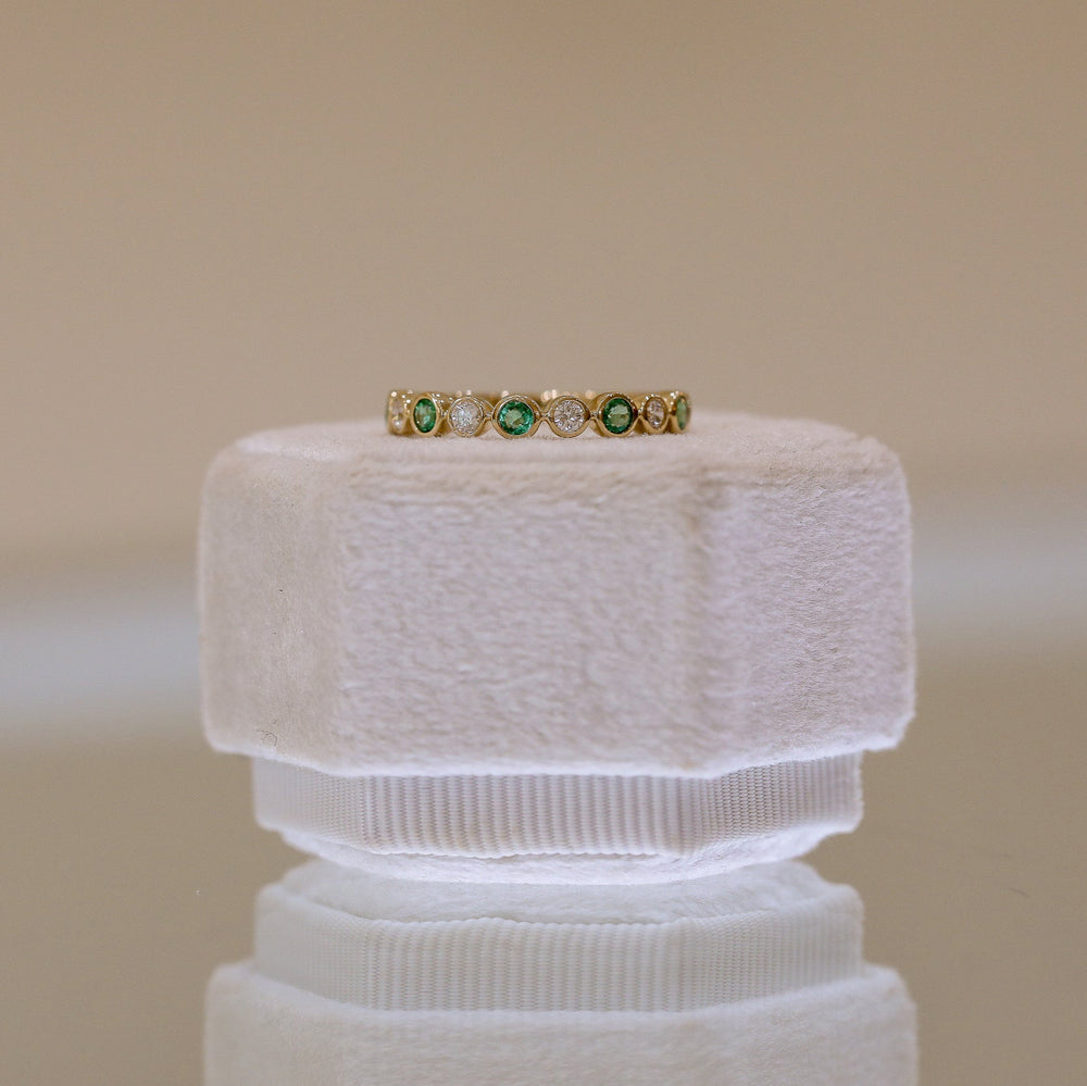 14ky .16ctw Diamond & .32ct Emerald Alternating Bezel Band