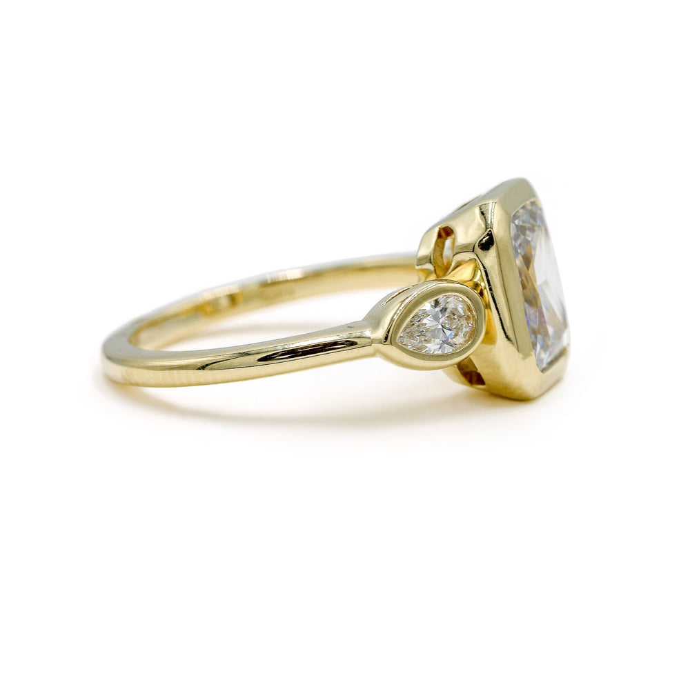 14ky Three Stone Bezel Radiant & .41ctw Pear-Shaped Lab Diamond Ring