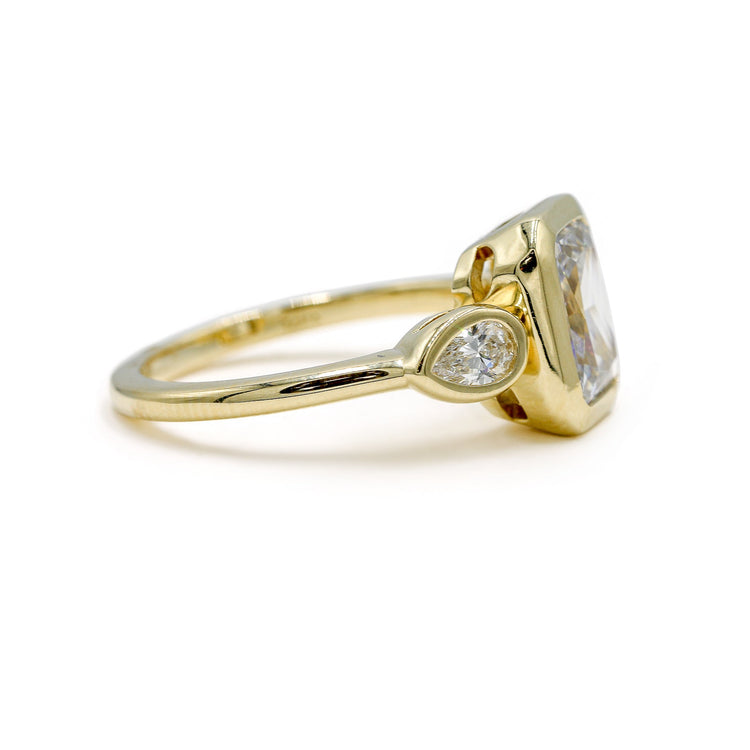 14ky Three Stone Bezel Radiant & .41ctw Pear-Shaped Lab Diamond Ring