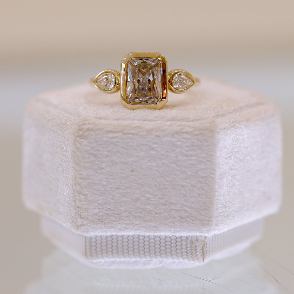 14ky Three Stone Bezel Radiant & .41ctw Pear-Shaped Lab Diamond Ring