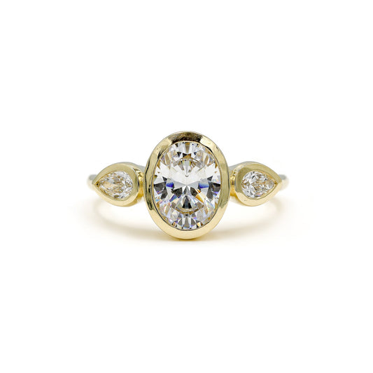 14ky Three Stone Bezel Oval & .41ctw Pear-Shaped Lab Diamond Ring