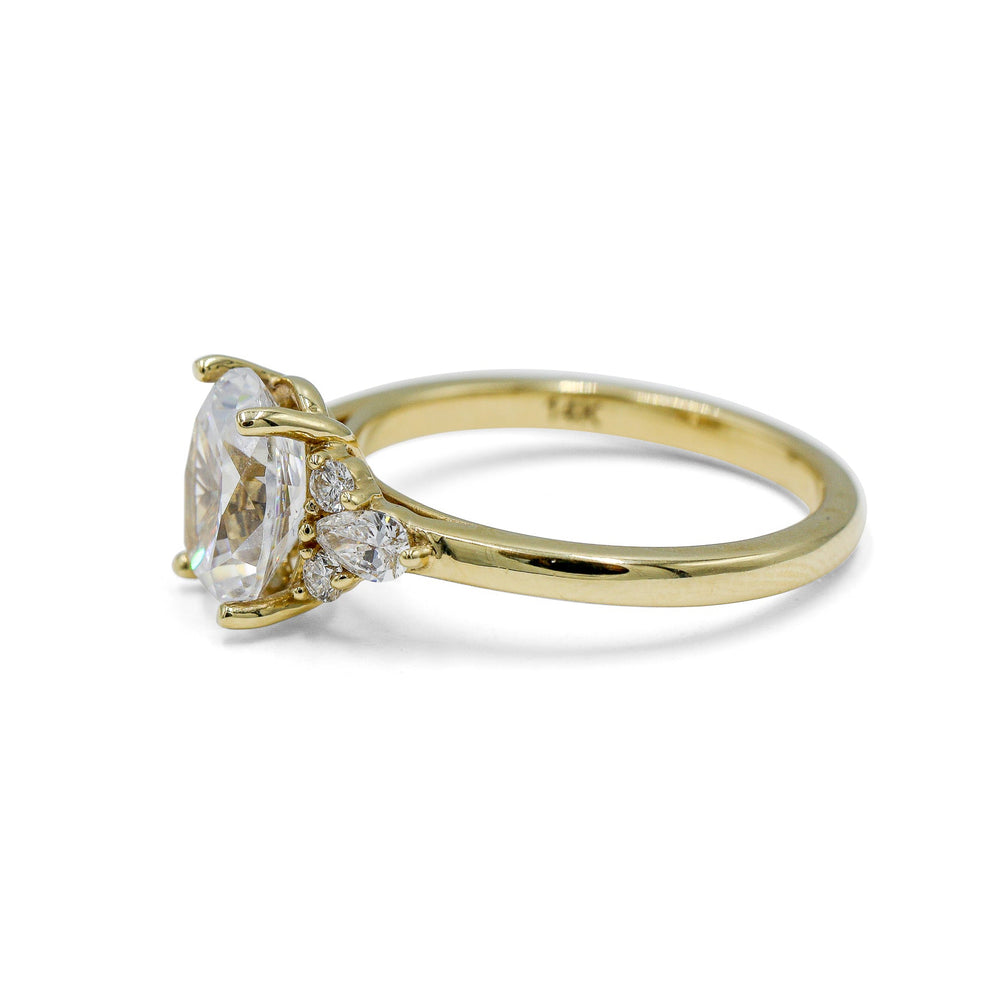 14ky Oval with .19ctw Pear and .11ctw Round Accent Ring