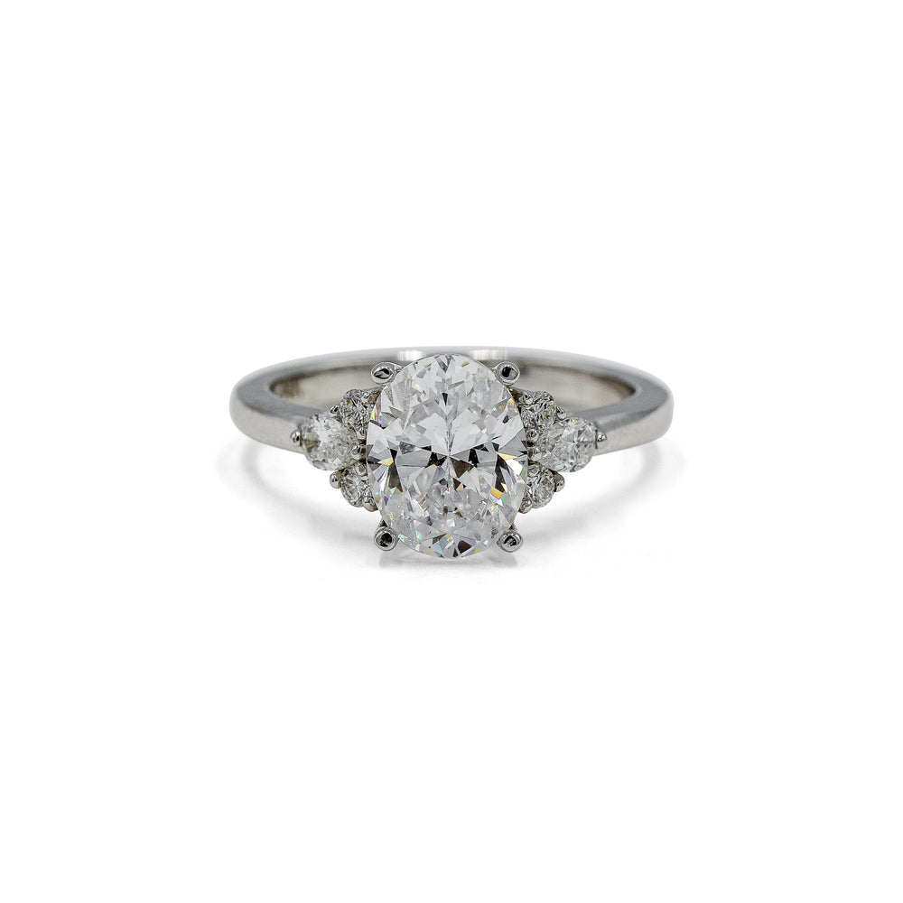 14kw Oval with .19ctw Pear and .11ctw Round Accent Ring
