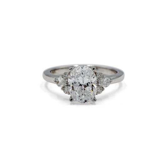 14kw Oval with .19ctw Pear and .11ctw Round Accent Ring