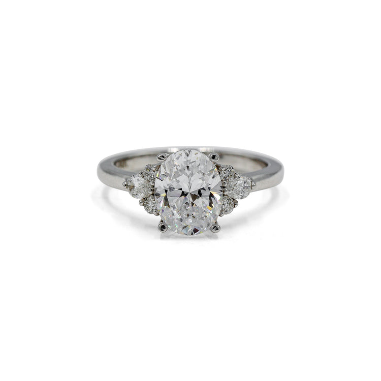 14kw Oval with .19ctw Pear and .11ctw Round Accent Ring