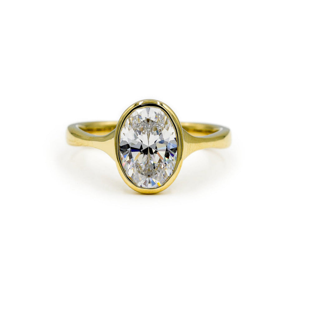 14ky Oval-Cut Bezel Tapered Cathedral Diamond Ring