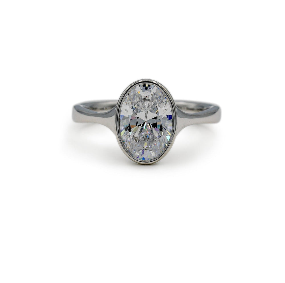 Platinum Oval-Cut Bezel Tapered Cathedral Diamond Ring