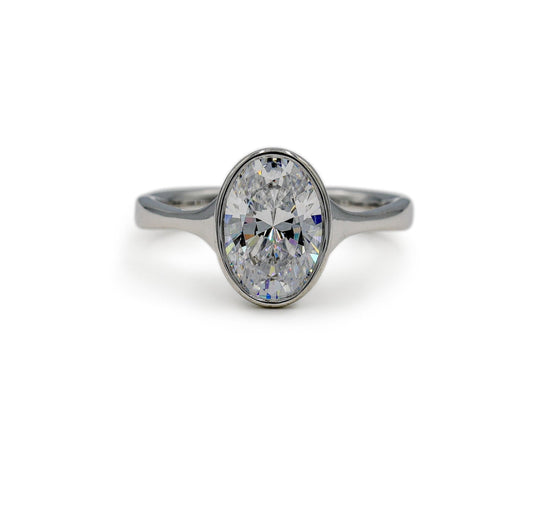 Platinum Oval-Cut Bezel Tapered Cathedral Diamond Ring
