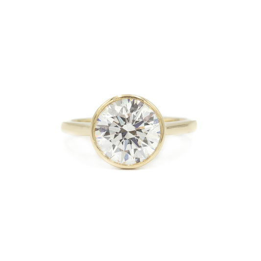 14ky Round Bezel Cathedral Diamond Ring
