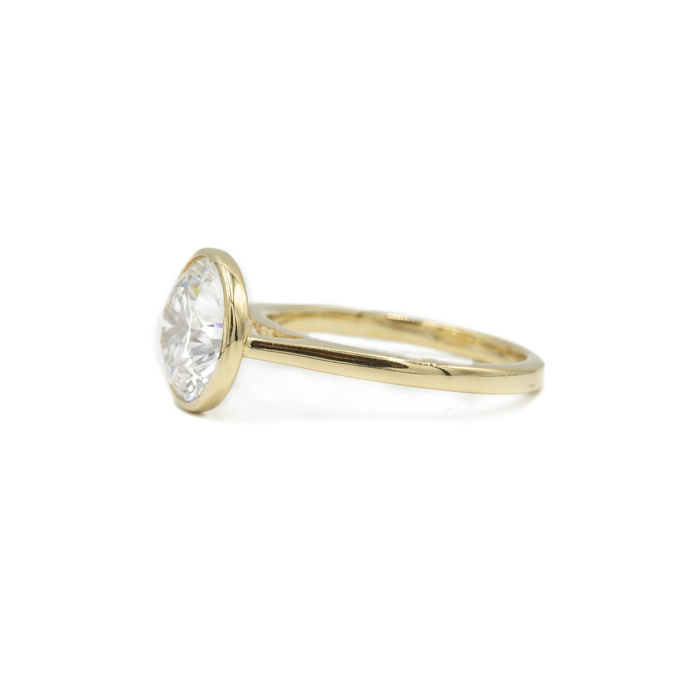 14ky Round Bezel Cathedral Diamond Ring