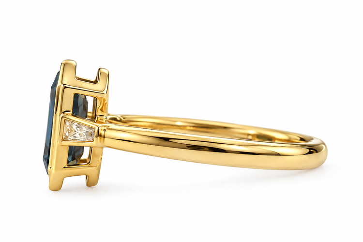 14ky 1.69ct Elongated Hexagon Teal Sapphire Bezel with .16ctw Lab Grown Tapered Baguette Ring